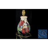 Moorcroft Lamp Base, Orchid & Spring Flowers, measures approx 11" tall.