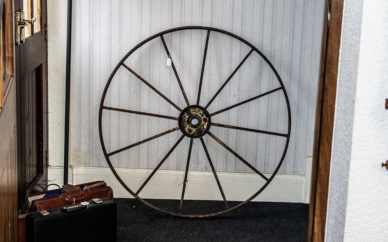 Large Cart Wheel, Paint Remnants.