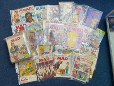 A Collection of MAD American Humor Magazines the majority in plastic sleeves.