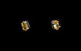 Yellow Sapphire Stud Earrings, solitaire oval cut yellow sapphires, a colour considerably rarer than