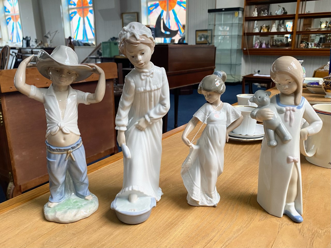A Collection of Nao by Lladro Figures (3) in total.