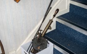 Two Vintage Industrial Metal Tools, comprising a heavy rope pulley, and a pump spray.