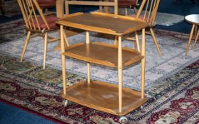 An Ercol Blonde Beech/Elm Three Tier Trolley 28 x 18 inches, height 31 inches. Raised on Casters.