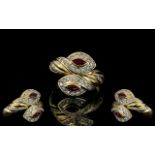 A Superb 18ct Gold Double Headed Snake Ring, Set with Diamond to Head with Ruby Set Eyes.