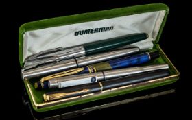 Collection of Five Vintage Pens, including a Waterman of France blue fountain pen with 14k nib,