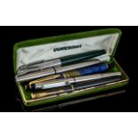 Collection of Five Vintage Pens, including a Waterman of France blue fountain pen with 14k nib,