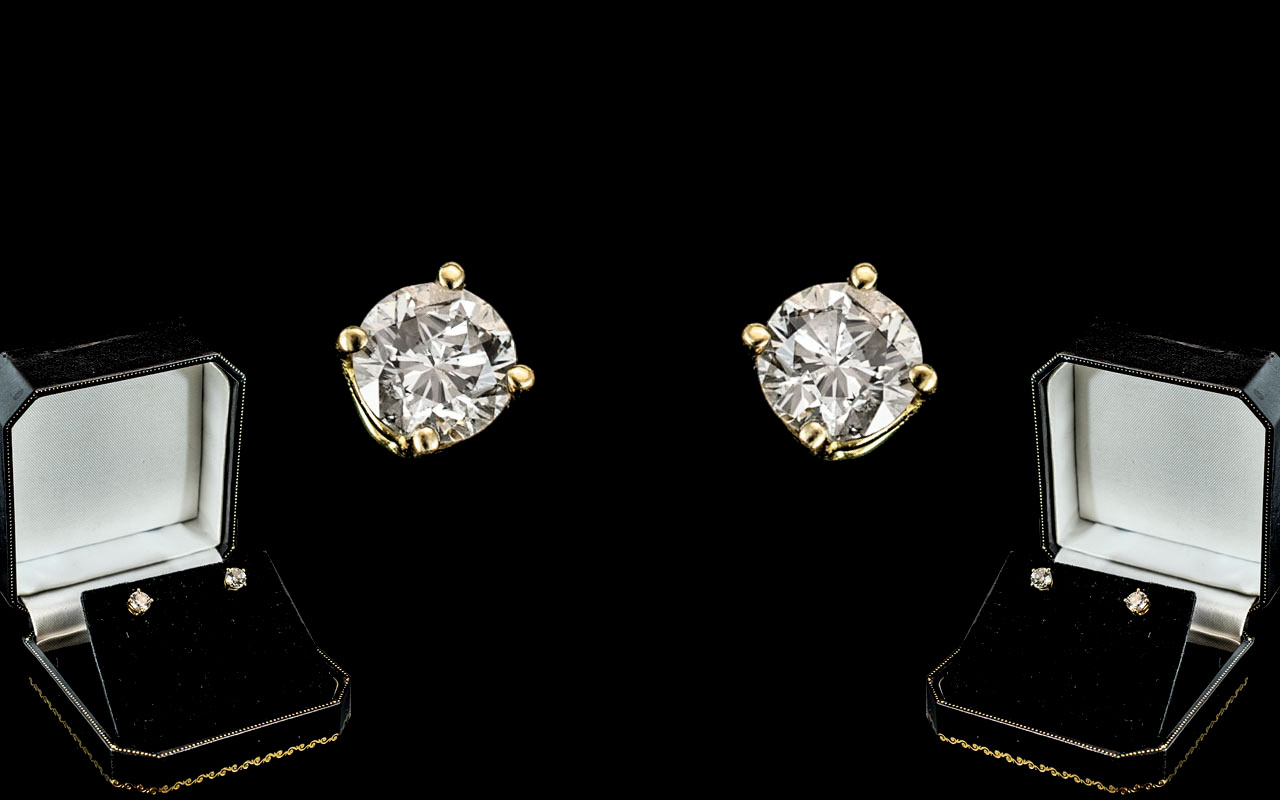 A Fine Pair of 18ct Gold Single Stone Diamond Set Earrings.