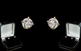 A Fine Pair of 18ct Gold Single Stone Diamond Set Earrings.