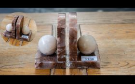 Pair of Marble Bookends, in a mottled brown/tan colour, with ball decoration.