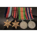 WW II Military Set of 4 Medals with Ribbons not named comprises 1. 1939-1945 Star 2. Burma Star 3.
