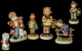 Four Goebel Hummel Figures, comprising a boy with a basket of chicks, girl with watering can,