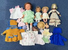 A Collection of Dolls (5) in total together with a few assorted clothes. Please see images.