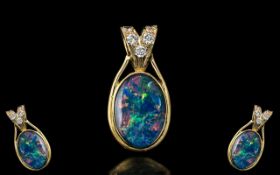 A Superb 18ct Gold Large Black Opal and Diamond Set Pendant. Marked 750 - 18ct.