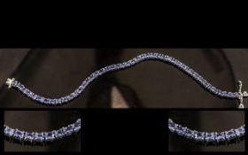 Tanzanite Tennis Bracelet, oval cut tanzanites, totalling 7cts, closely set in a single row,