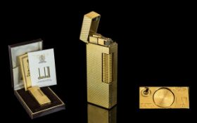 Dunhill Gold Plated Lighter with box and papers. Excellent condition all aspects.