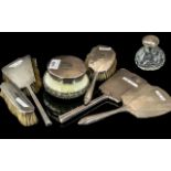 A Seven Piece Silver Backed Dressing Table Set To Include, Two Mirrors, Three Brushes,