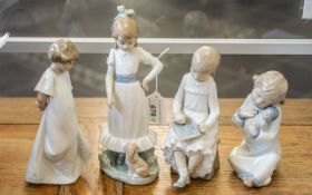 Four Nao Figurines, comprising a girl with a doll, Schoolgirl writing her ABC, Girl with Puppy,