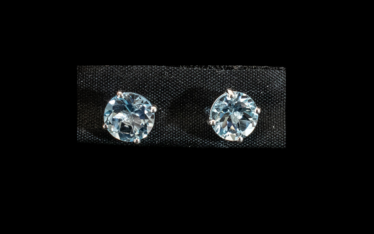 Blue Topaz Stud Earrings, 6cts of blue topaz over two solitaire, round cut stones,