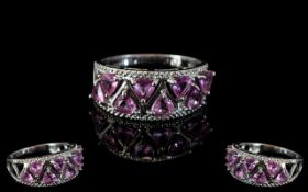 9ct White Gold Ladies Dress Ring set with 8 pink topaz in tulip design.
