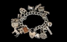 Excellent Quality - Vintage Sterling Silver Charm Bracelet Loaded with 18 Charms.