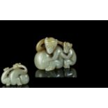 A Small Jade Carving Depicting Two Monkeys 2 inches long.