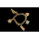 Ladies 9ct Gold Charm Bracelet With 4 Gold Charms - And Heart Shaped Gold Clasp and Safety Chain.