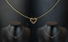 Ladies Elegant 9ct Gold Necklace with Heart Shaped Pendant With 3 Diamonds. Hallmarked for 9ct Gold.