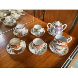 A Part Japanese Teaset comprising milk jug, two handled sugar bowl and 6 cups and 6 saucers.