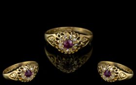 18ct Gold Antique Ruby & Diamond Ring, central Ruby surrounded by nine rosecut diamonds.