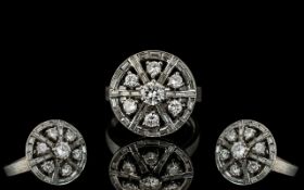 A Fine Quality & Attractive White Gold Diamond Set Ring, of wheel design.