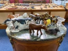 A Collection of Pottery Comprising Mainly Cow Figures Including Brass and Wooden Figures.