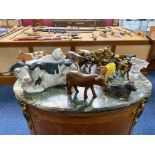 A Collection of Pottery Comprising Mainly Cow Figures Including Brass and Wooden Figures.