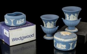 Collection of Wedgwood Blue Jasperware, comprising urn vases and pots. Four in total, one boxed.