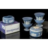 Collection of Wedgwood Blue Jasperware, comprising urn vases and pots. Four in total, one boxed.