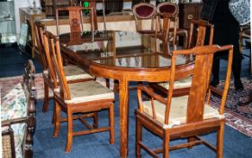 A Late 20th Century Mahogany Chinese Style Extending Table And Chairs Table Of Circular Form,