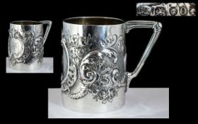 Victorian Period Sterling Silver Embossed Floral Decorated Small Cup with Triangle Shaped Handle.