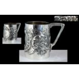 Victorian Period Sterling Silver Embossed Floral Decorated Small Cup with Triangle Shaped Handle.