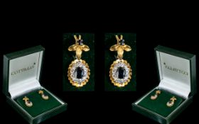 9ct Gold Diamond & Sapphire Earrings, drop stye with a central sapphire surrounded by diamonds.