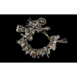 A Good Quality Vintage, Heavy Sterling Silver Charm Bracelet - Loaded With Over 25 Silver Charms,