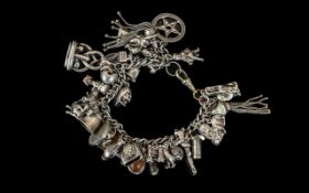 A Good Quality Vintage, Heavy Sterling Silver Charm Bracelet - Loaded With Over 25 Silver Charms,