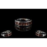 Garnet Half Eternity Ring, size R; baguette cut garnets, totalling 3cts, channel set, across the