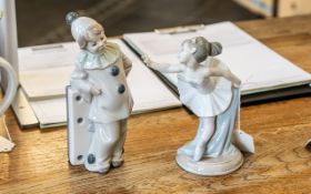 Lladro Domino Clown Figure, measures 8" tall, together with a Nao ballerina figure 7" tall,