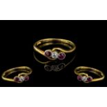 18ct Gold Antique Ruby & Diamond Ring, central diamond surround by two rubies on a twist.