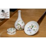 Wedgwood 'Wild Strawberry' Set comprising a pin dish, lidded pot and bud vase.