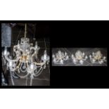 Three Matching Decorative Crystal Chandeliers, each set with six candle lights, crystal drops and