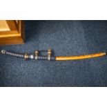 Decorative Oriental Display Cutlass in leather case with decorative blue and gold handle.