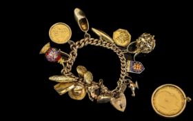 A Vintage Good Quality 9ct Gold Charm Bracelet, loaded with 14 9ct Gold Charms,