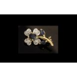 9ct Gold Diamond & Sapphire Brooch, in the form of a flower, diamond petals.
