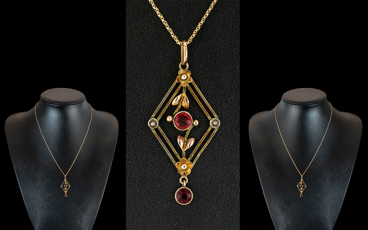 Victorian Period Attractive 9ct Gold Exquisite Open Worked Pendant, set with rubies and seed pearls.