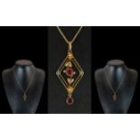 Victorian Period Attractive 9ct Gold Exquisite Open Worked Pendant, set with rubies and seed pearls.